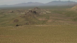 4K aerial stock footage fly over Mojave Desert hills in San Bernardino County, California Aerial Stock Footage | FG0001_000041