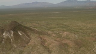 4K aerial stock footage fly over hills and open Mojave Desert in San Bernardino County, California Aerial Stock Footage | FG0001_000042