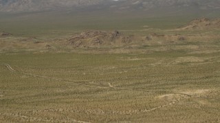 4K aerial stock footage fly over Mojave Desert hills in San Bernardino County, California Aerial Stock Footage | FG0001_000046