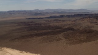 4K aerial stock footage of a Mojave Desert mountain range and arid plains in San Bernardino County, California Aerial Stock Footage | FG0001_000066