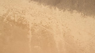 FG0001_000067 - 4K aerial stock footage of bird's eye view of a Mojave Desert dry lake in San Bernardino County, California