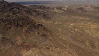 4K aerial stock footage tilt from Mojave Desert mountains to reveal Pisgah Crater in San Bernardino County, California Aerial Stock Footage | FG0001_000078