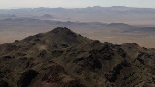 4K aerial stock footage top of a rugged Mojave Desert mountain in San Bernardino County, California Aerial Stock Footage | FG0001_000083