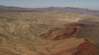 4K aerial stock footage of passing the Rodman Mountains and colorful striations in the Mojave Desert, San Bernardino County, California Aerial Stock Footage | FG0001_000099