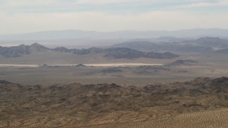 4K aerial stock footage of Iron Ridge mountains and desert ridges in the background in the Mojave Desert, San Bernardino County, California Aerial Stock Footage | FG0001_000111