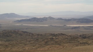 4K aerial stock footage wide view of Iron Ridge mountains and distant desert ridges in the Mojave Desert, San Bernardino County, California Aerial Stock Footage | FG0001_000112