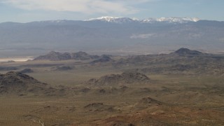 4K aerial stock footage of the San Bernardino Mountains behind Mojave Desert mountains, San Bernardino County, California Aerial Stock Footage | FG0001_000113