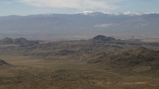 4K aerial stock footage of the snowy San Bernardino Mountains and Mojave Desert mountains, San Bernardino County, California Aerial Stock Footage | FG0001_000117