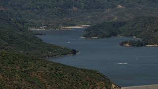 FG0001_000130 - 4K aerial stock footage of watercraft race across Silverwood Lake in California