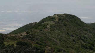 4K aerial stock footage of passing a mountain ridge in the San Bernardino Mountains of California Aerial Stock Footage | FG0001_000133