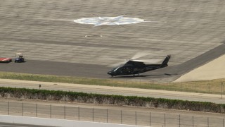 4K aerial stock footage of a civilian helicopter on the ground at Whiteman Airport, Pacoima, California Aerial Stock Footage | FG0001_000151