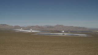 4K aerial stock footage tilt from blue sky to reveal Ivanpah Solar Electric Generating System in California Aerial Stock Footage | FG0001_000175