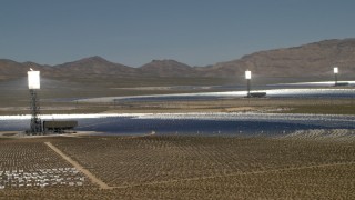 FG0001_000180 - 4K aerial stock footage of row of power towers and mirrors of the Ivanpah Solar Electric Generating System in California