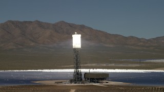 FG0001_000195 - 4K aerial stock footage orbit an array and reveal the others at the Ivanpah Solar Electric Generating System in California