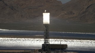 4K aerial stock footage zoom tighter on one of the power towers at the Ivanpah Solar Electric Generating System in California Aerial Stock Footage | FG0001_000198