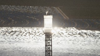 4K aerial stock footage of a view of a boiler atop a power tower at the Ivanpah Solar Electric Generating System in California Aerial Stock Footage | FG0001_000201