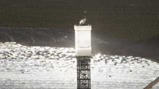 4K aerial stock footage of a power tower boiler on one of the arrays at the Ivanpah Solar Electric Generating System in California Aerial Stock Footage | FG0001_000202