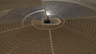 FG0001_000211 - 4K aerial stock footage of looking down at one of the solar power structures at the Ivanpah Solar Electric Generating System in California