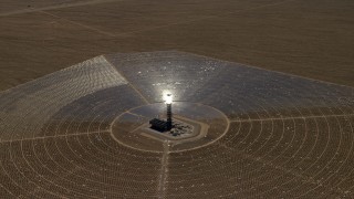 4K aerial stock footage zoom and approach one of the power towers at the Ivanpah Solar Electric Generating System in California Aerial Stock Footage | FG0001_000219