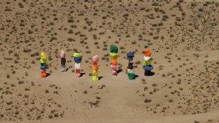 4K aerial stock footage of Seven Magic Mountains rock formation in the desert outside of Las Vegas, Nevada Aerial Stock Footage | FG0001_000225