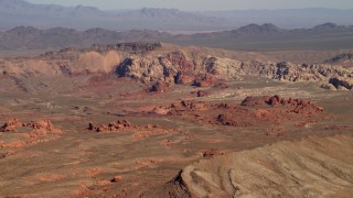 4K aerial stock footage of red rock formations near a mountain ridge in the Nevada Desert Aerial Stock Footage | FG0001_000258