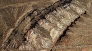 4K aerial stock footage tilt to a bird's eye view of a scarred hillside in the Nevada Desert Aerial Stock Footage | FG0001_000266