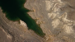 FG0001_000273 - 4K aerial stock footage of an overhead view of flat plain the Nevada Desert, and reveal the shore of Lake Mead