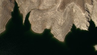 4K aerial stock footage of a bird's eye view of the green water of Lake Mead, and reveal the desert shore Aerial Stock Footage | FG0001_000275