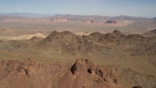 FG0001_000284 - 4K aerial stock footage of a view of rugged, barren mountains in the Nevada Desert