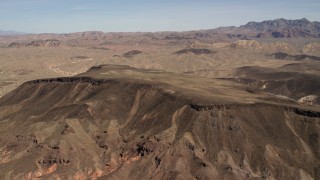 FG0001_000299 - 4K aerial stock footage of a mesa in the barren landscape of the Nevada Desert