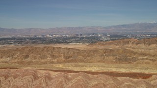 4K aerial stock footage fly over barren desert mountains to approach Las Vegas, Nevada Aerial Stock Footage | FG0001_000302