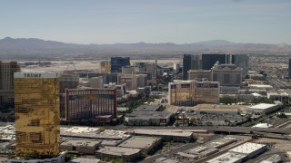 FG0001_000323 - 4K aerial stock footage of Las Vegas Strip resort casinos seen while passing Treasure Island and The Mirage in Nevada