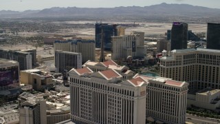 FG0001_000325 - 4K aerial stock footage of Paris Las Vegas and Planet Hollywood seen from Caesar's Palace and the Bellagio on the Las Vegas Strip in Nevada