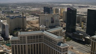 FG0001_000326 - 4K aerial stock footage of Paris Las Vegas and Planet Hollywood seen from the Bellagio, The Cosmopolitan, and reveal Aria on the Las Vegas Strip in Nevada