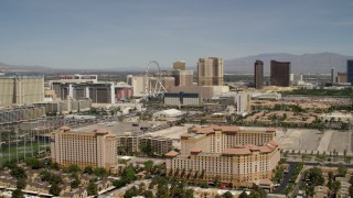 4K aerial stock footage approach and pan across casino resorts on the Las Vegas Strip, Nevada Aerial Stock Footage | FG0001_000334