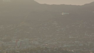 HD stock footage aerial video Griffith Observatory at sunset, seen from Downtown Los Angeles, California Aerial Stock Footage | HDA06_22