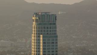 HD stock footage aerial video view of Griffith Observatory, reveal and orbit US Bank Tower in Downtown Los Angeles, California at sunset Aerial Stock Footage | HDA06_23