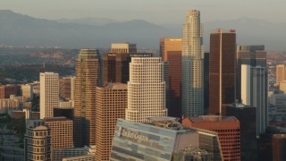 HD stock footage aerial video flying by the skyscrapers of Downtown Los Angeles at sunset, California Aerial Stock Footage | HDA06_27