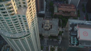 HD stock footage aerial video bird's eye view of S Hope Street and the Los Angeles Public Library at sunset, Downtown Los Angeles, California Aerial Stock Footage | HDA06_33