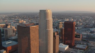 HD stock footage aerial video flyby Figueroa at Wilshire and 777 Tower at sunset in Downtown Los Angeles, California Aerial Stock Footage | HDA06_45