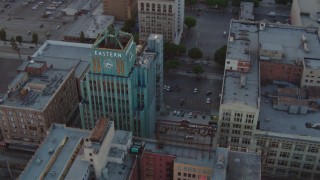 HD stock footage aerial video orbit Eastern Columbia Building condo complex at sunset in Downtown Los Angeles, California Aerial Stock Footage | HDA06_48