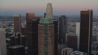 HD stock footage aerial video fly over Figueroa at Wilshire to approach US Bank Tower at twilight, Downtown Los Angeles, California Aerial Stock Footage | HDA06_61