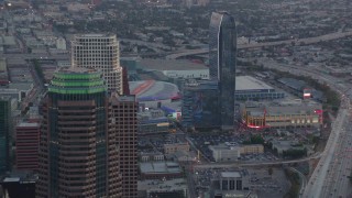 HD stock footage aerial video flyby skyscrapers in Downtown Los Angeles at twilight to reveal Staples Center and Ritz-Carlton in California Aerial Stock Footage | HDA06_63