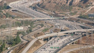 HD stock footage aerial video following I-5 with heavy traffic, San Fernando Valley, California Aerial Stock Footage | HDA07_07