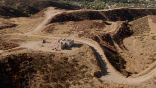 HDA07_20 - HD stock footage aerial video circling abandoned building in Santa Clarita Valley, California