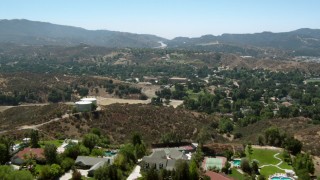 HD stock footage aerial video of flying over hills and homes in Newhall, California Aerial Stock Footage | HDA07_24