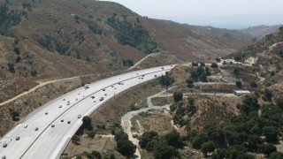 HDA07_28 - HD aerial stock footage video of Newhall Pass with light traffic in Santa Clarita, California