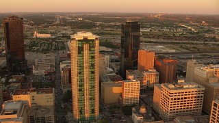 HDA12_011 - HD stock footage aerial video of flying by tall skyscrapers at sunset in Downtown Fort Worth, Texas