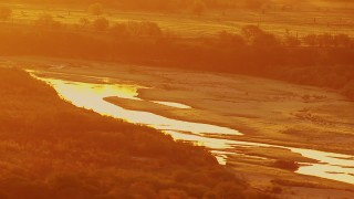 HDA12_055 - HD stock footage aerial video of Red River at sunrise, and oil rigs on the Texas side of the border