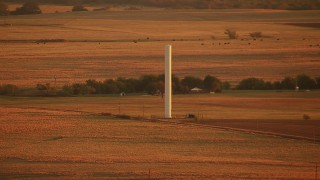 HDA12_057 - HD stock footage aerial video of a silo on a farm at sunrise in Oklahoma